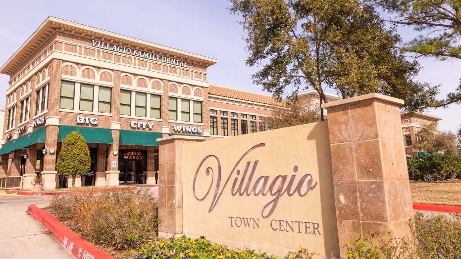 Villagio Town Center sign outside of Villagio Family and Cosmetic Dental